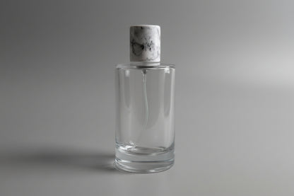 Glass perfume bottle complete with pump, spray and cap.
